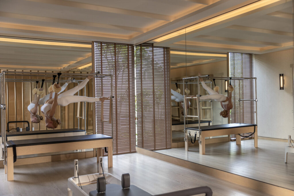 Copy of Layan Life by Anantara Pilates Room With Female Model scaled 1